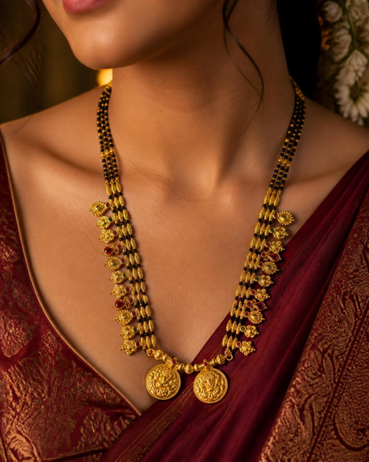 Woman wearing Kolhapuri saaj style long mangalsutra with maroon silk saree