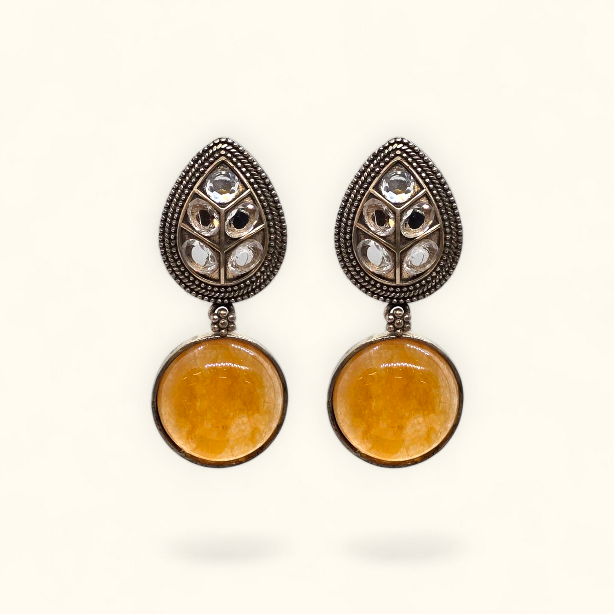 Handcrafted oxidised drop earrings with antique German silver finish and gemstone detailing – close-up