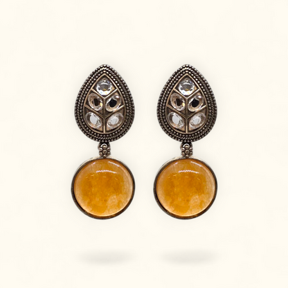 Handcrafted oxidised drop earrings with antique German silver finish and gemstone detailing – close-up