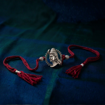 Oxidised Silver Lord Shankar Rakhi — front view, circular Shiva portrait pendant, handcrafted in Maharashtra