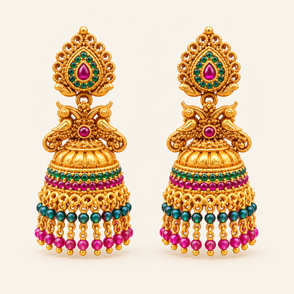 Pair of gold-plated peacock jhumkas with pink and green stones and dangling bead tassels