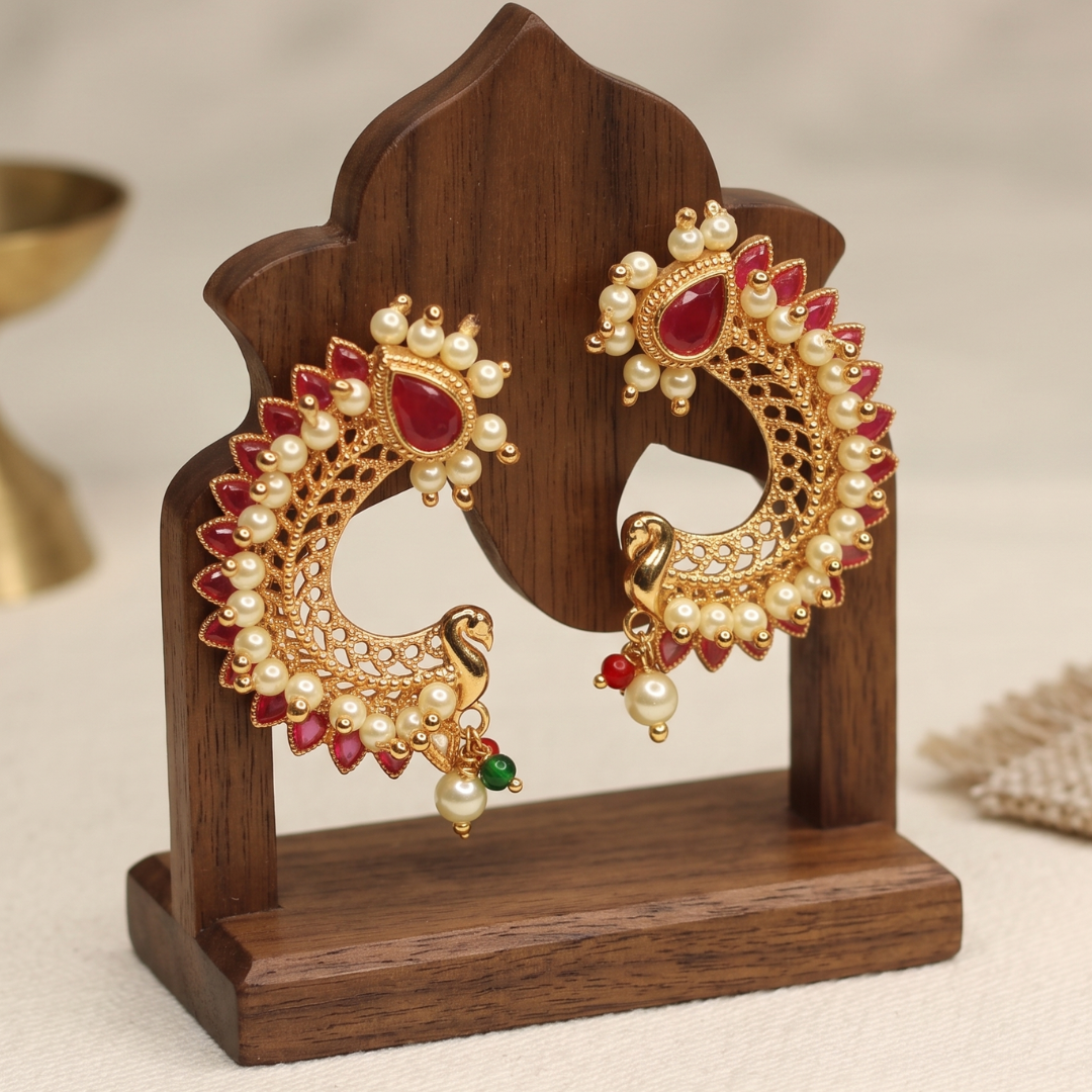 Model wearing peacock-shaped ruby and pearl gold-plated stud earrings, traditional Maharashtrian temple jewellery