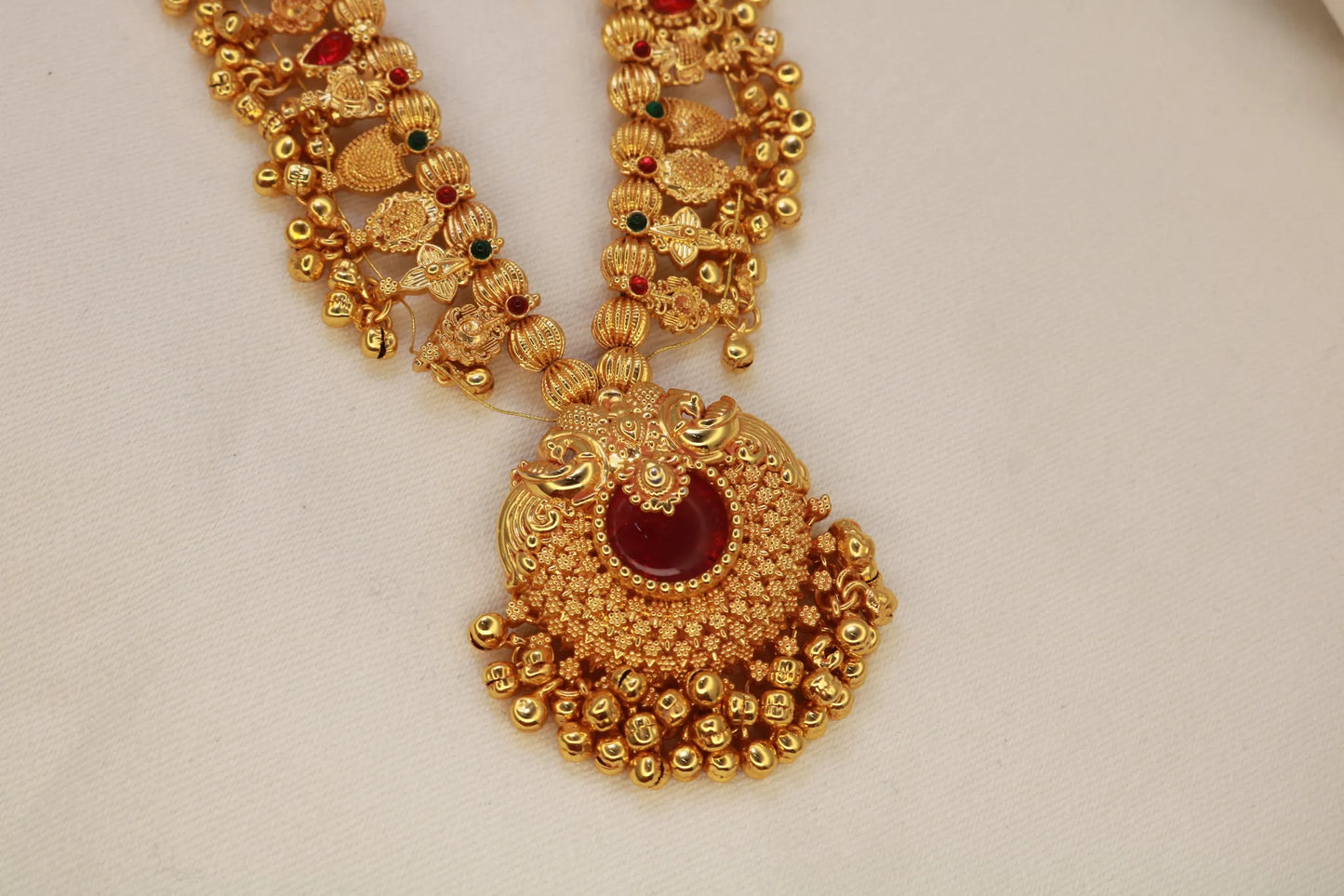 Kolhapuri Saaj Necklace with intricate gold plating and red accents.