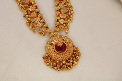 Kolhapuri Saaj Necklace with intricate gold plating and red accents.