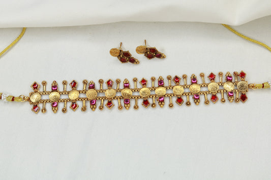 Maharashtrian gold plated coin choker necklace with red and pink stone embellishments and matching earrings
