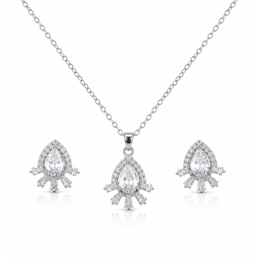 Close-up of silver-tone pear-cut cubic zirconia halo pendant with baguette crystal accents