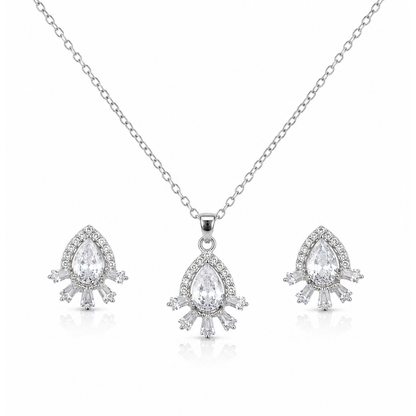 Close-up of silver-tone pear-cut cubic zirconia halo pendant with baguette crystal accents