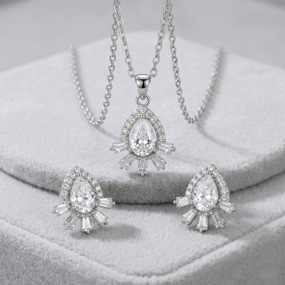 Matching silver teardrop halo CZ stud earrings styled for weddings and festive wear